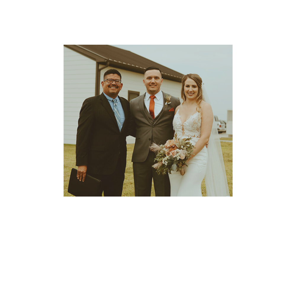 Officiant Alfonso Jaime with Texas Wedding Ministers smiling with couple after wedding ceremony