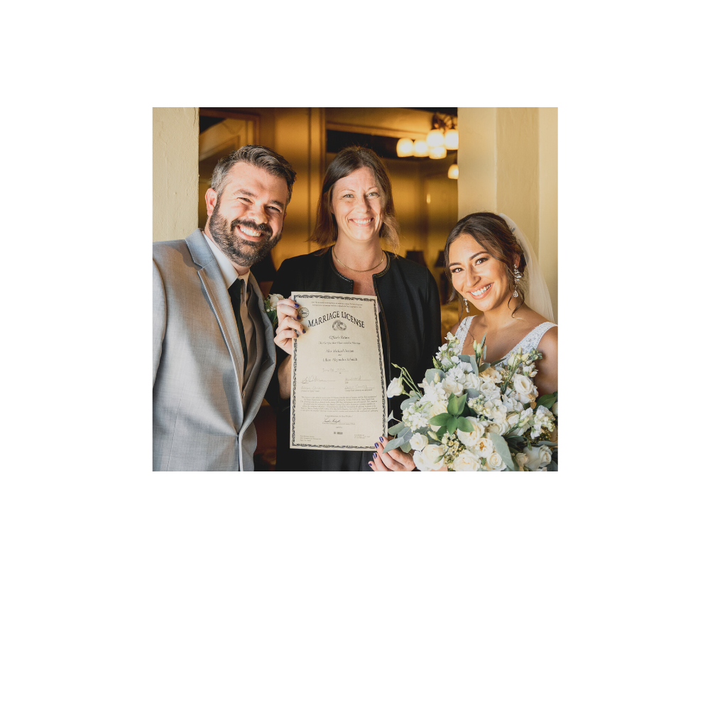 Minister Allison Donohue with Texas Wedding Ministers smiling with couple and their marriage license