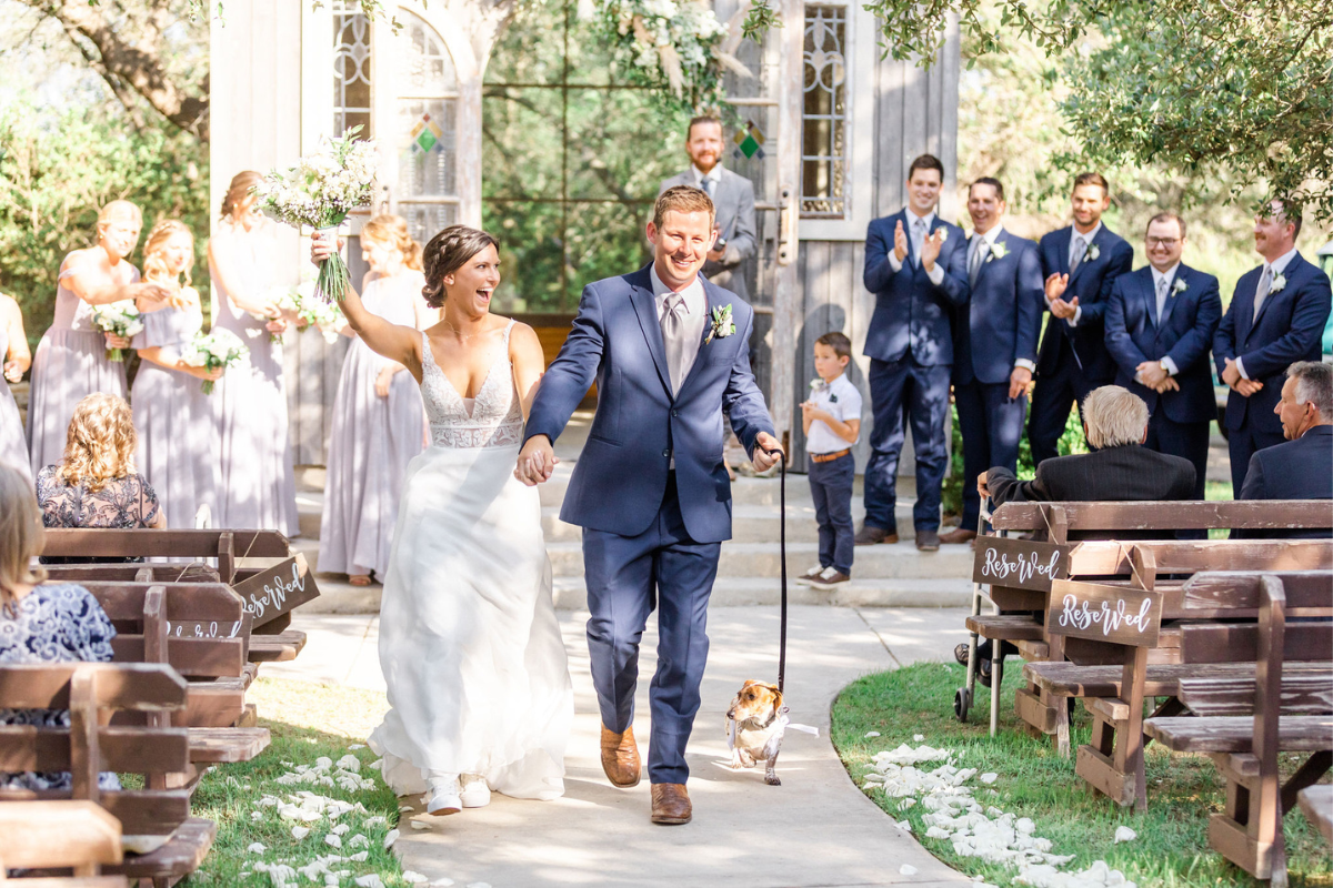 Bride and Groom walking away from ceremony with Texas Wedding Ministers