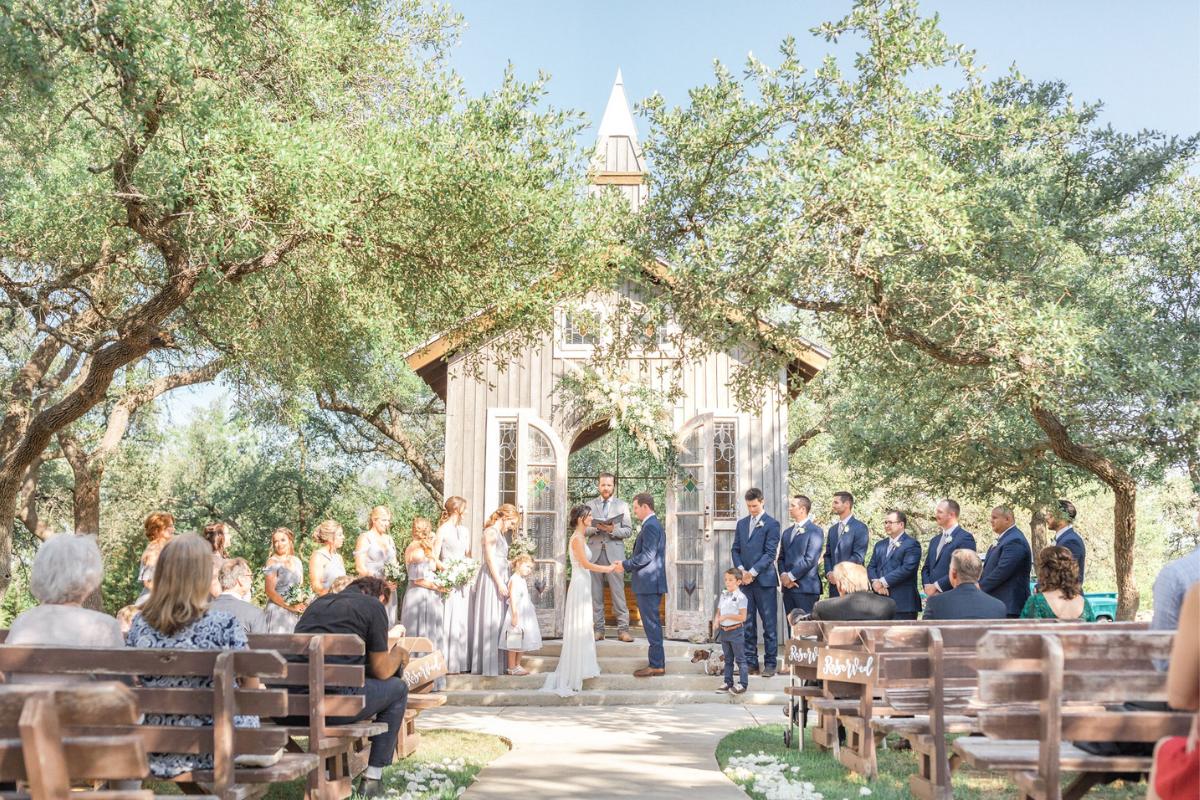 Texas Wedding Ministers couple standing during ceremony at firefly farms. 