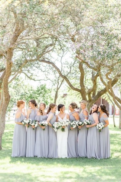 Texas Wedding Minister Bride with bridesmaids looking at each other and laughing