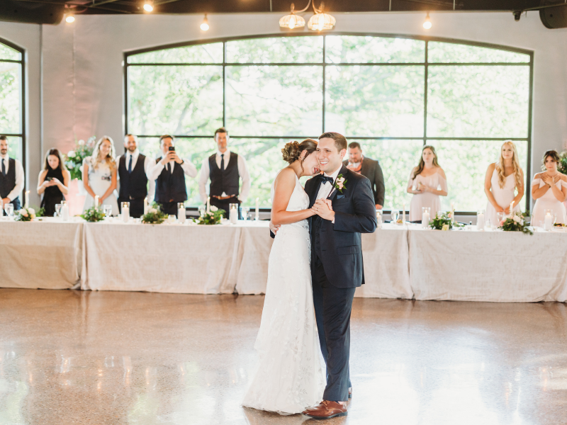 Texas Wedding Ministers Couple during their first dance in front of the bridal table